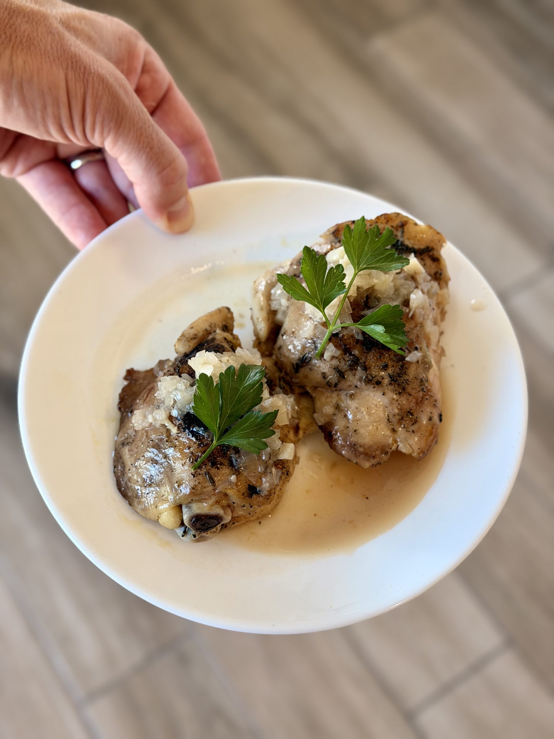 Golden Chicken Thighs in White Wine with Garlic, Lemon, and a Sauce You’ll Want to Mop Up