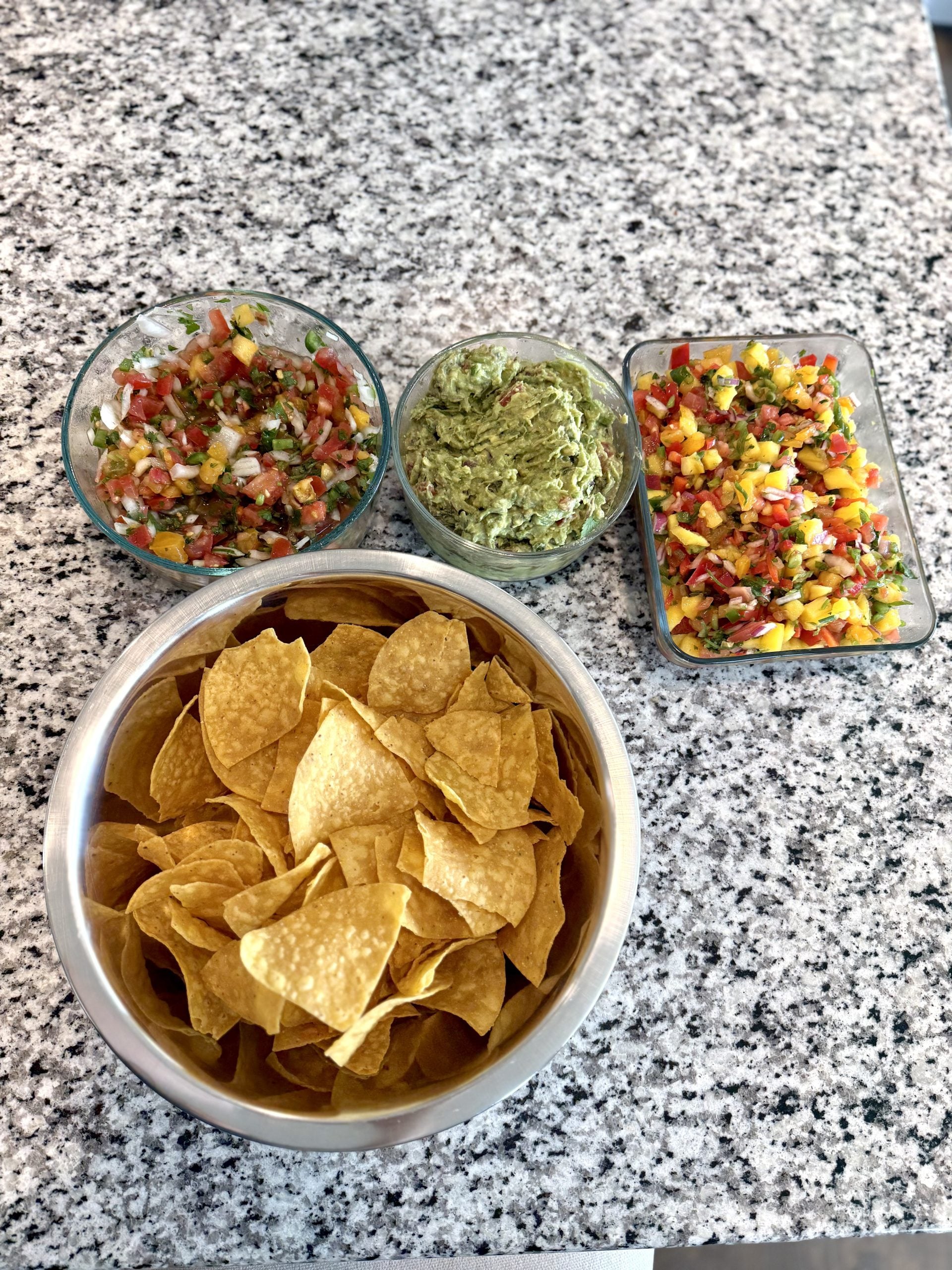 24) Guacamole + Mango Salsa with Tortilla Chips